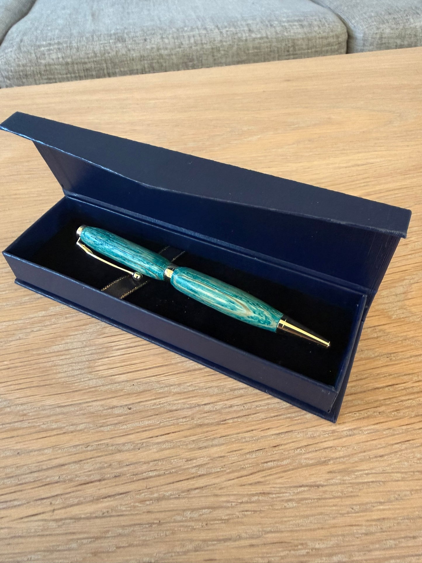 Hand-turned pen in colored oak with 24k gold plating