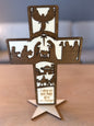 Cross on a foot in wood with three Christmas motifs and texts (28 cm)