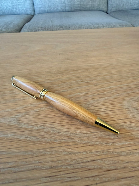 Hand-turned fruitwood pen with 24k gold plating