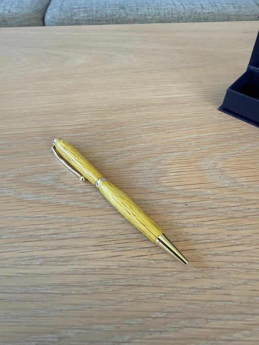 Hand-turned colored oak pen with 24k gold plating