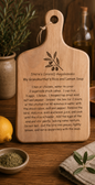 Engraved wooden cutting board featuring a traditional family recipe for Greek Avgolemono soup